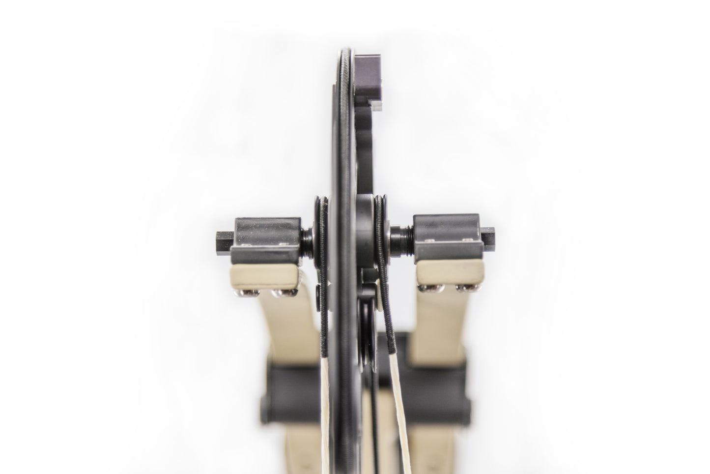 Close-up view of a precision mechanical device showcasing a circular component and armature with a focus on its gears and joints.